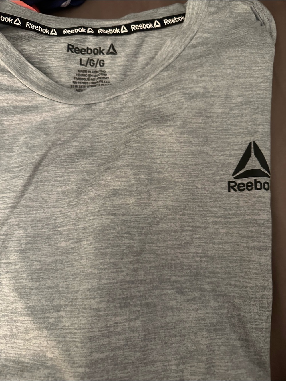2 Reebok shirts one Light Gray and one Black Short-Sleeve Performance Tee